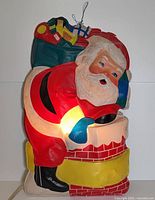 Front view of illuminated plastic Santa Claus figure
