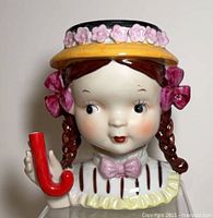 Front view of ceramic girl head vase