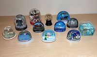 All 12 snow globes front view