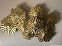 Front view showing eight gold rosette discs