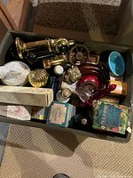 Bin showing all ten Avon collectible items together