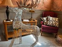 Full view of metal wireframe reindeer with lights