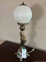 Full view of figural table lamp unlit