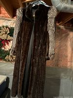 Front view of full-length mink coat on hanger