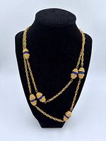 Rope chain necklace displayed on bust showing bead design and length