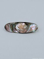 Front view of abalone shell brooch