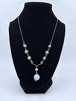 Full view of sterling silver wrap necklace on display bust