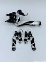 Front view of cat ring and earrings showing design and size relationship