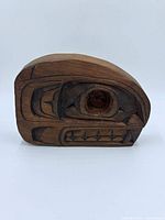 Front view of carved whale eye design