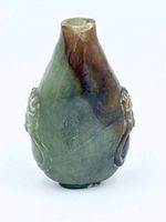 Front view of mottled green and brown jade snuff bottle