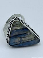 Front view triangular labradorite ring in sterling silver floral bezel