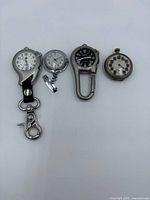 All four watches laid out left to right