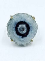 Front view of ring showing solar quartz slice with concentric rings