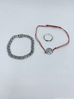 Overview of bracelet, ring and cord necklace