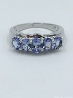 Front view showing five tanzanite stones on ring