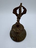 Full view of brass bell with dorje handle
