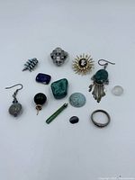 overview of all thirteen jewelry and gemstone pieces