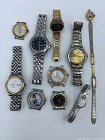 All eleven watches laid out to show variety and condition