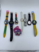 All eight watches laid out for overall view