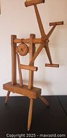 Full view of hardwood yarn winder showing reel, crank and base