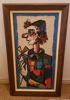 Front view of framed clown portrait painting