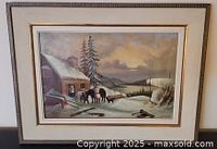 Front view of framed winter landscape painting