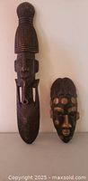 Front view of both carved wooden masks
