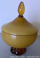 Jar assembled showing overall form, foot, bowl, lid and finial