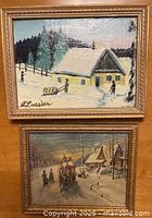 Front view showing both framed winter landscape paintings