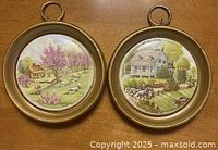 Both plaques front view showing size, frames, and scenes