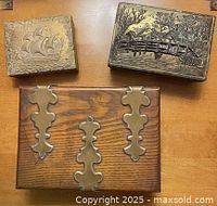 Top view of three boxes showing designs and materials