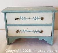 Front view showing two drawers, paint scheme and knobs