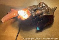 Lamp lit showing working bulb and wood grain