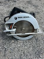 Left side view showing blade guard, logo, blade size marking