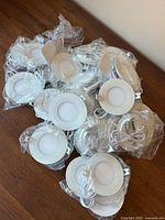 Pile of packaged round LED recessed light fixtures