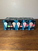 Five boxed Ecosmart LED A19 bulbs displayed front labels visible