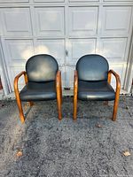 Front view of both Global chairs against garage door