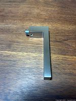 single lever handle angled view showing L-shape and mounting end