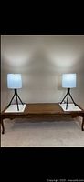 Both assembled lamps illuminated on table