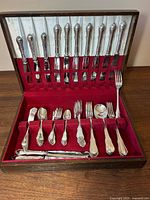 Open canteen showing cutlery set and red felt interior