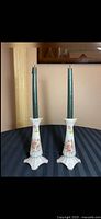 Full view of both candlesticks standing with candles