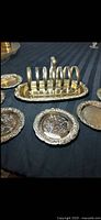 Set displayed on table showing holder and five coasters