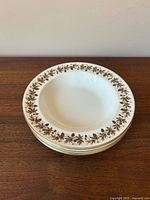 Stacked view of bowls showing border pattern and gold trim