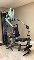 Full view of Body-Solid Fusion 400 home gym showing frame, press arms, seat, leg developer, cable system