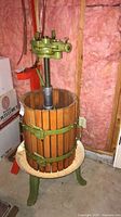 Full view of wine press showing basket, screw, ratchet head and legs