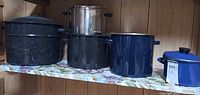 All four cookware pieces on shelf
