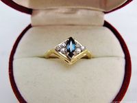 Ring inside box showing setting and stones