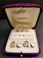 Full view of open Birks case showing cufflinks, shirt studs, collar studs
