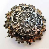 Front view showing overall design and patina