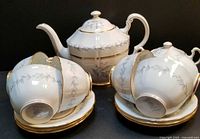 Full set showing teapot, sugar bowl, six cups and saucers